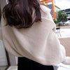 Sweater scarf with sleeves